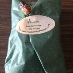 Green tissue paper packaging for Eye Balm with dried flower embellishment