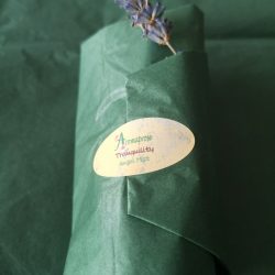 green tissue paper packaging for pillowmist with lavender embellishment