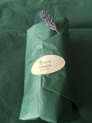 green tissue paper packaging for pillowmist with lavender embellishment