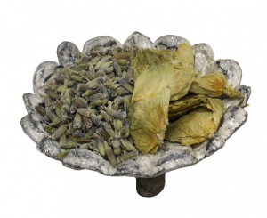 a small dish of dried lavender and hops
