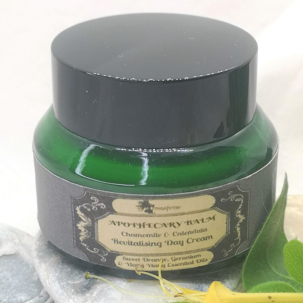 Revitalising cream in green glass jar