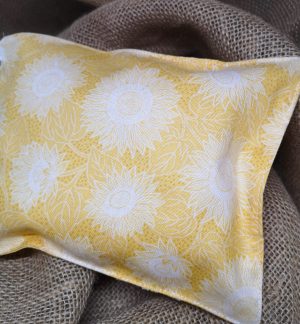 reverse side of yellow herbal pillow