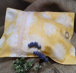 a yellow and white herbal pillow