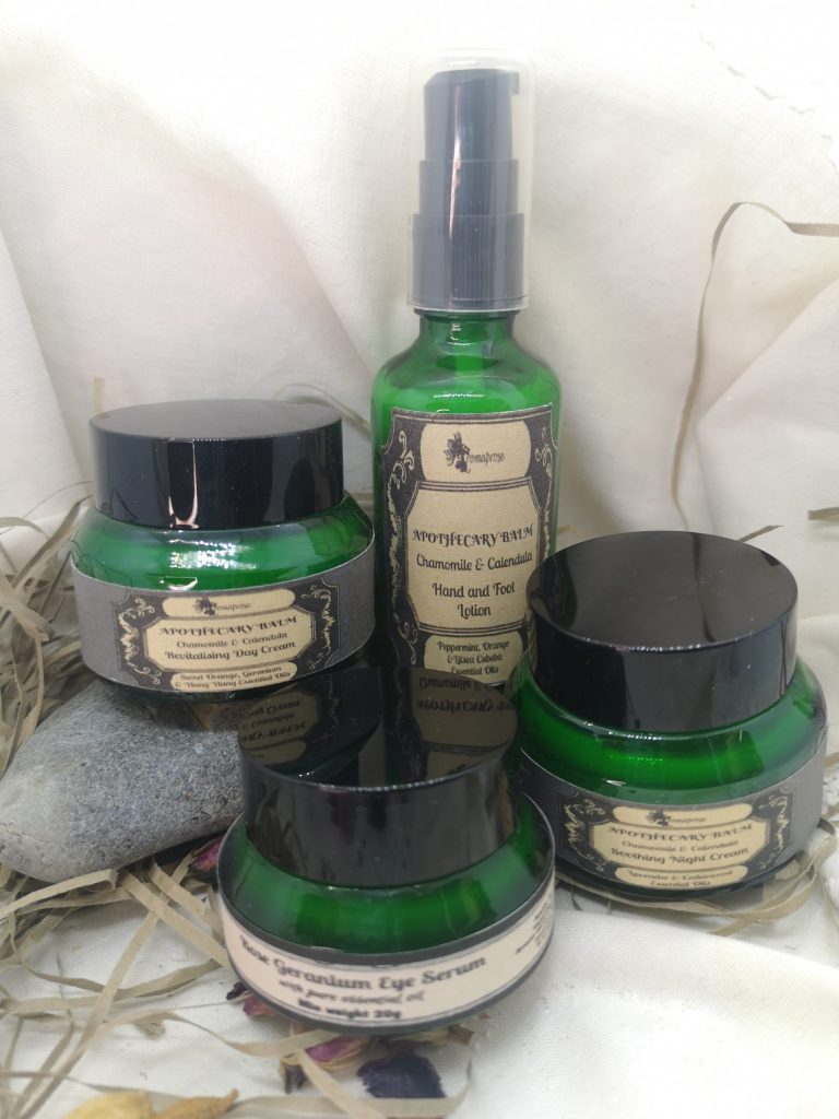 Apothecary creams in green glass bottles