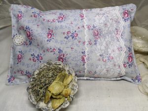 Pink and grey floral fabric herbal pillow with lavender and hops infill