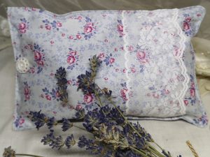 pink and grey floral herbal pillow with lace and button detail