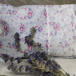 pink and grey floral herbal pillow with lace and button detail