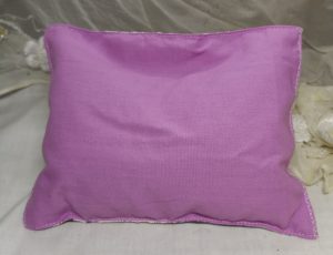 pink back of floral herbal pillow