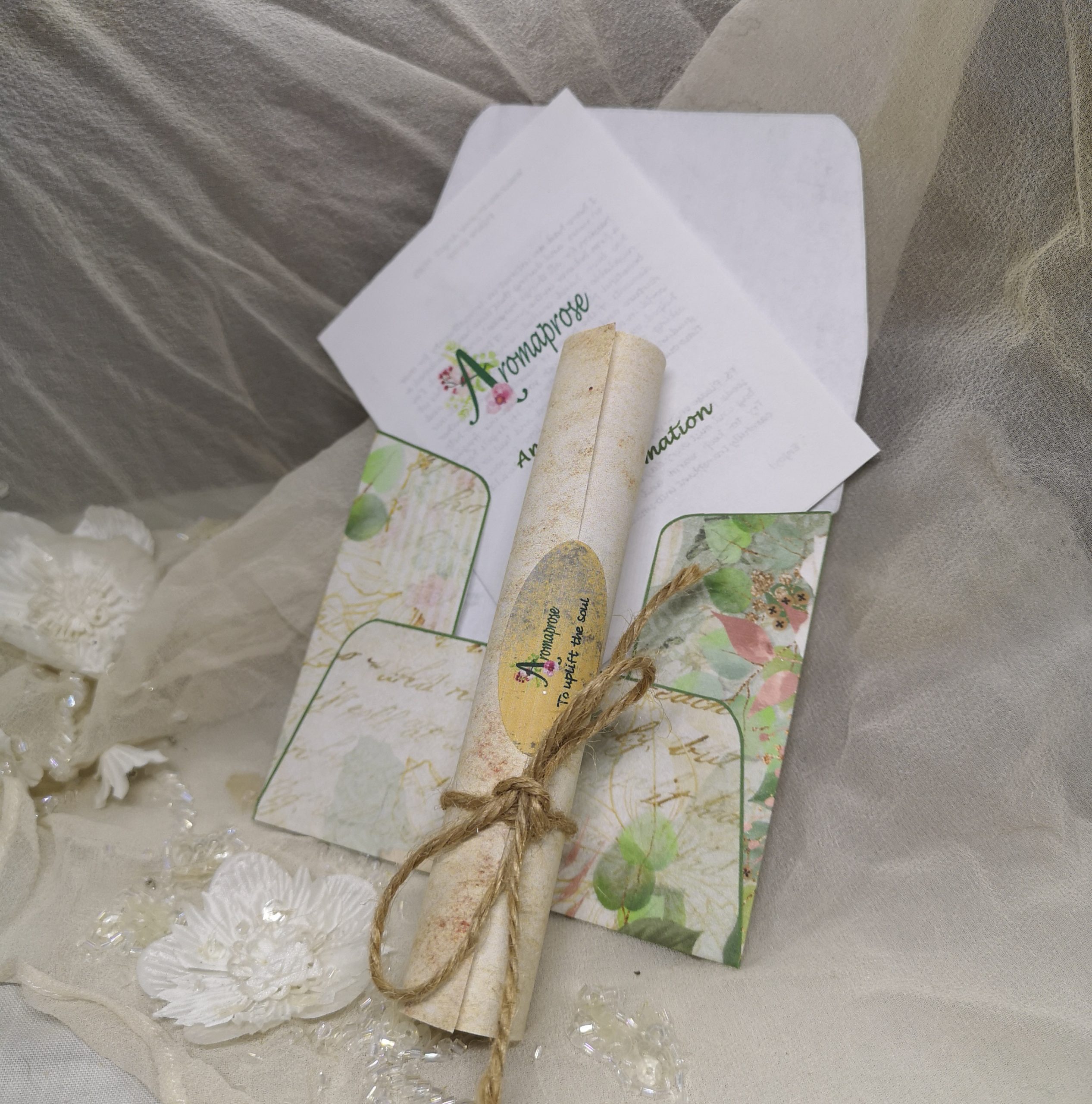 A green floral envelope and scrolled poem