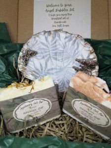 A gift box set with seashell dish and handmade soaps