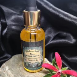 A golden facial oil in a dropper bottle
