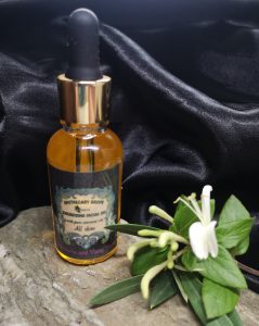 A golden facial oil in dropper bottle