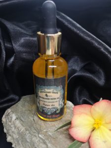 A golden facial oil in dropper bottle