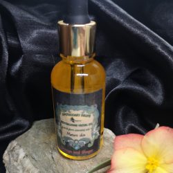 A golden facial oil in dropper bottle
