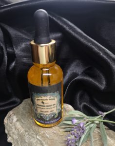 A golden facial oil in a dropper bottle