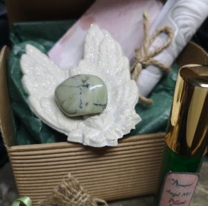 Green Moss Agate crystal on dish